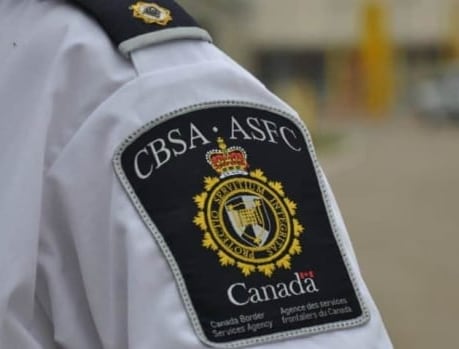 Close-up of a shoulder patch with the name and logo of the Canada Border Services Agency.