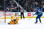 Jake DeBrusk (74) scores on Nashville Predators goaltender Juuse Saros (74) during the shootout