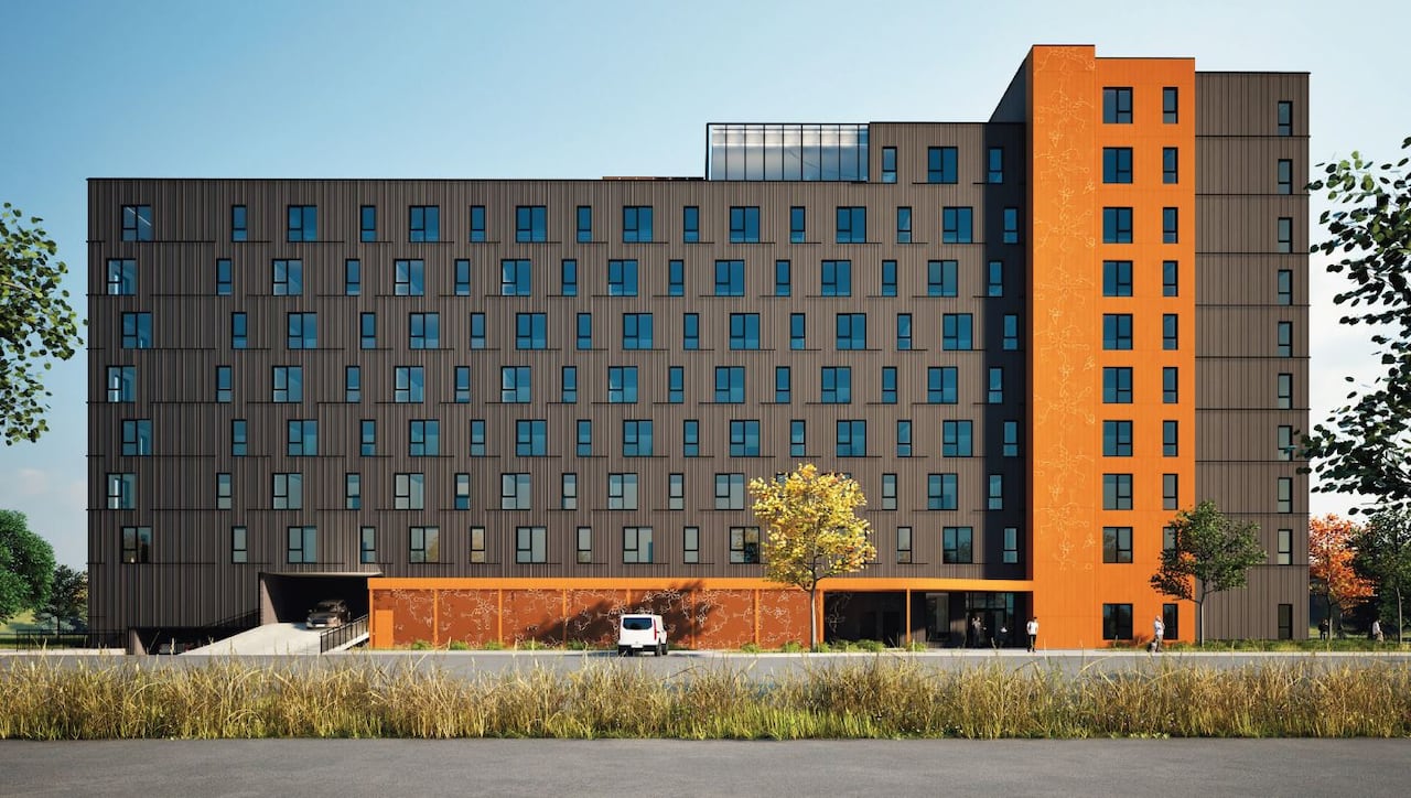 An artists endering shows a large apartment building.