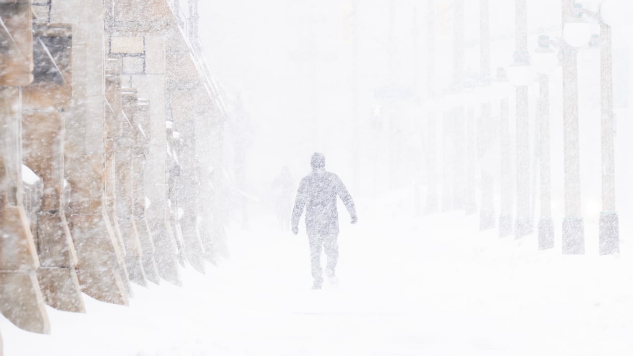 A person walks through the streets of Ottawa during a snow storm, in Ottawa, Thursday, Jan. 15, 2026. 