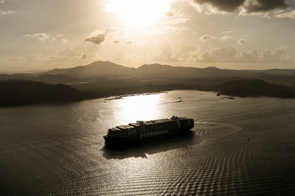 A cargo ship transits the Panama Canal in Panama City, Thursday, March 12, 2026. (AP Photo/Matias Delacroix)