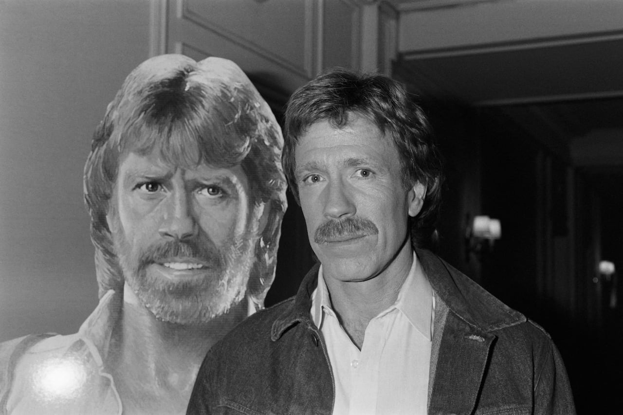 A man stands next to a cardboard cut out of himself