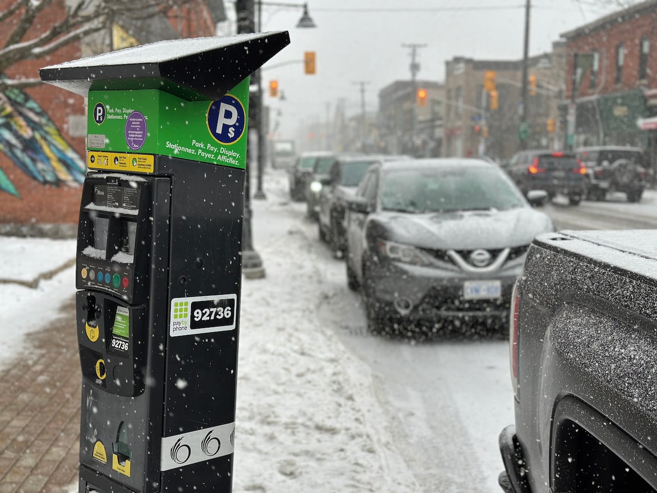 Parking meter and parked cars on Bank Street in the Glebe on March 20, 2026