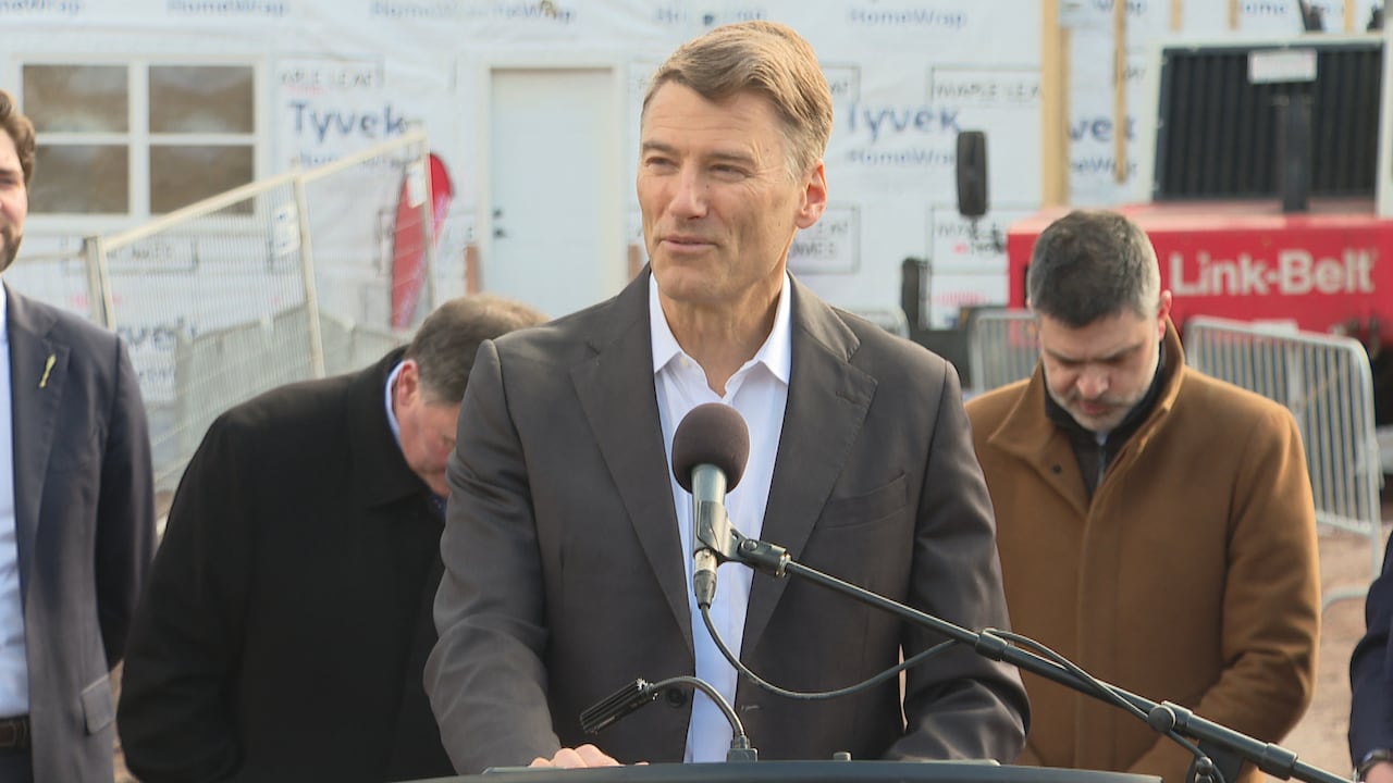 Gregor Robertson speaks at a podium.