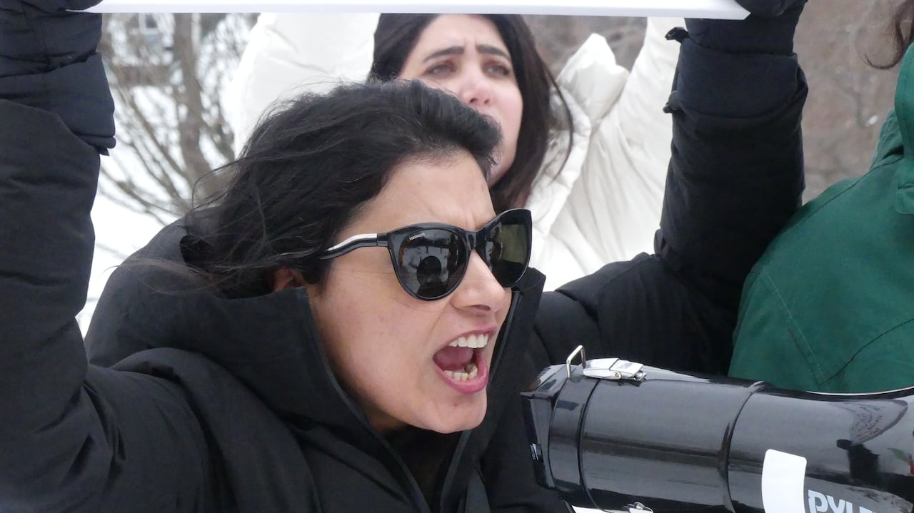 Woman shouting into megaphone