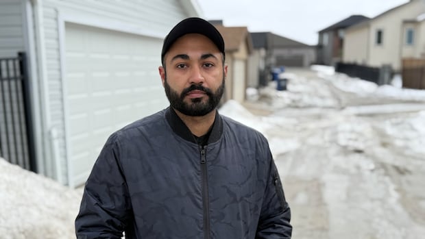 Winnipeg residents chip away at frozen drains to curb spring flooding