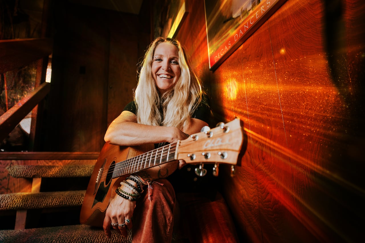 Roots rock singer Sarah Smith with her guitar. 
