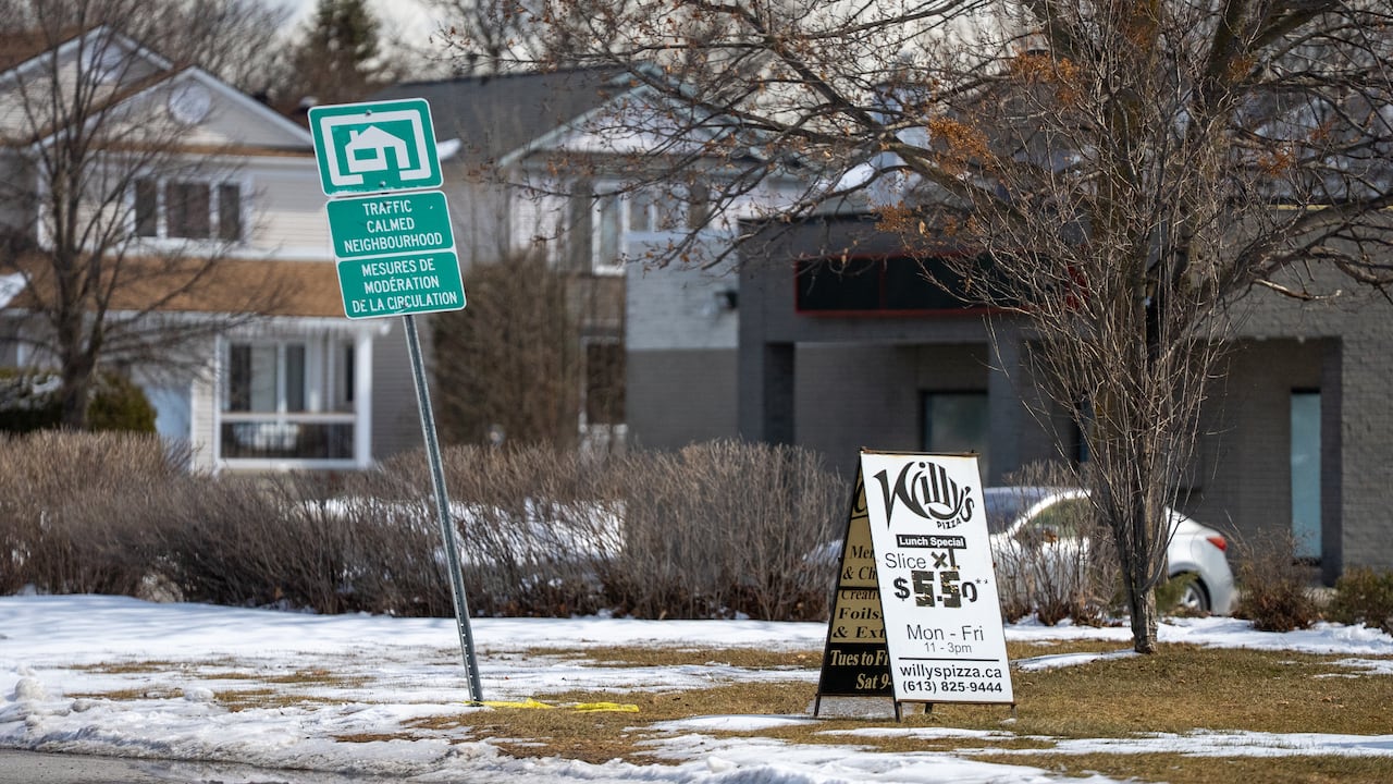 traffic calmed neighbourhood sign near intersection of hit and run, photo taken March 23, 2026