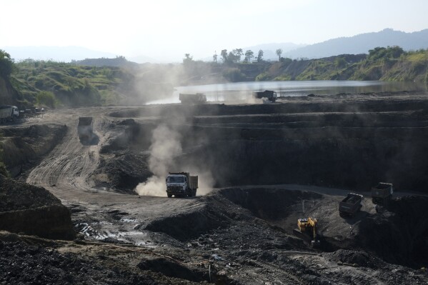 FILE- Machineries work at an open pit coal mining site in Tiru valley of Wokha district, in the northeastern state of Nagaland, India, Dec. 15, 2021. (AP Photo/Yirmiyan Arthur, File)