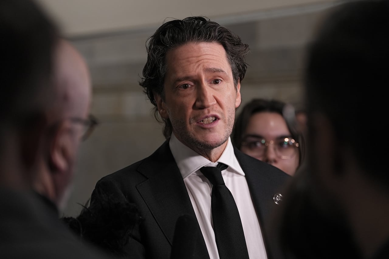A man speaking to a group of people