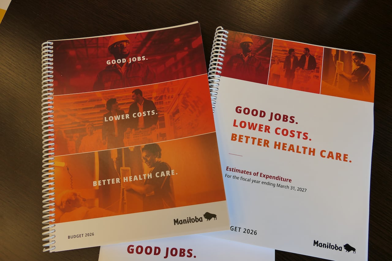 A closeup shows documents lying on a table.