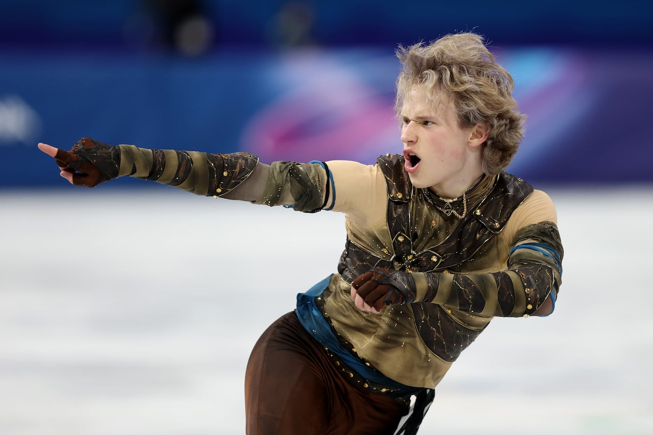 A men's figure skater competes.