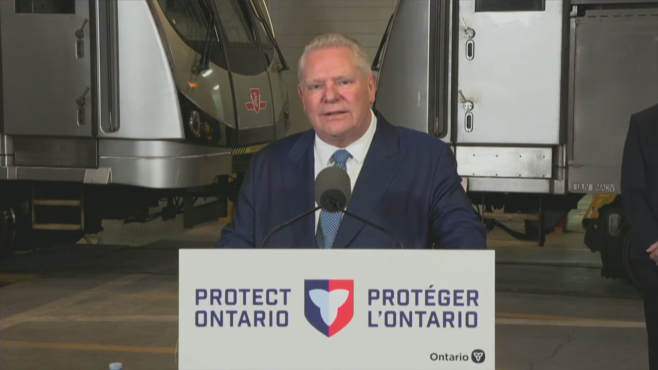 A man speaks at a podium.