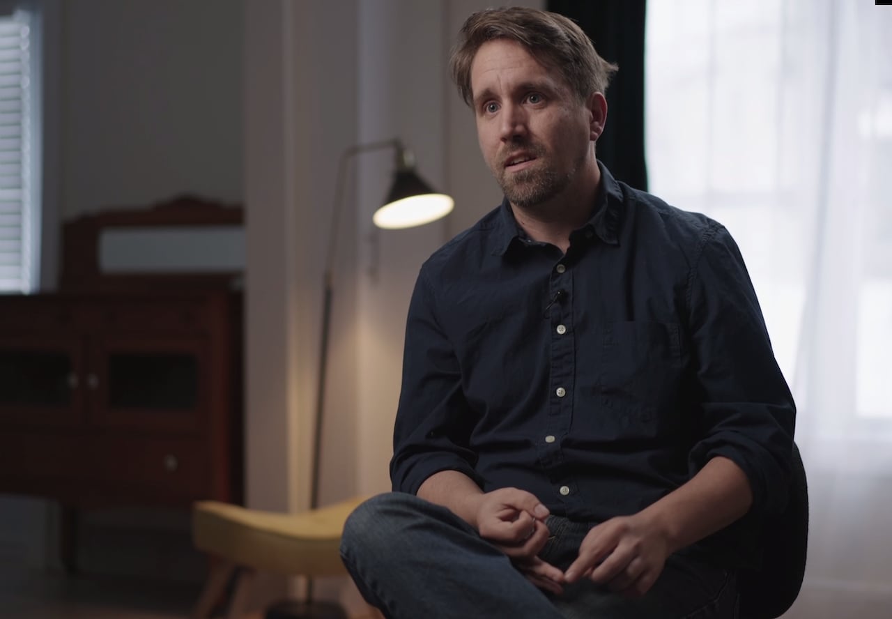 A man sitting in a chair. 
