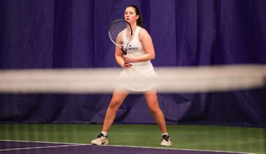 Marie Weissheim walks with a ball and raquet in hand
