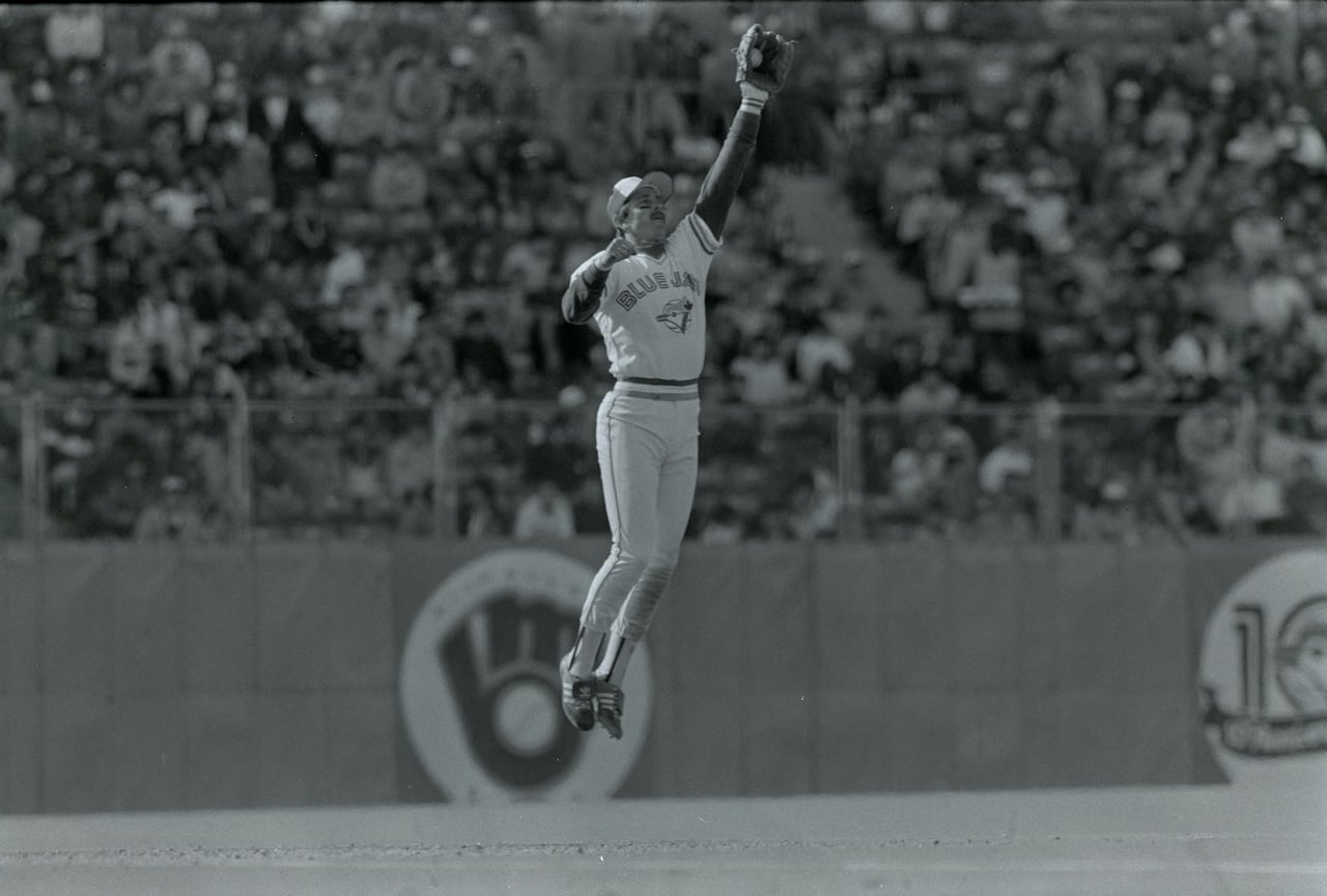 Rance Mulliniks of the Toronto Blue Jays leaps high to snag a line drive during an April 1986 ballgame