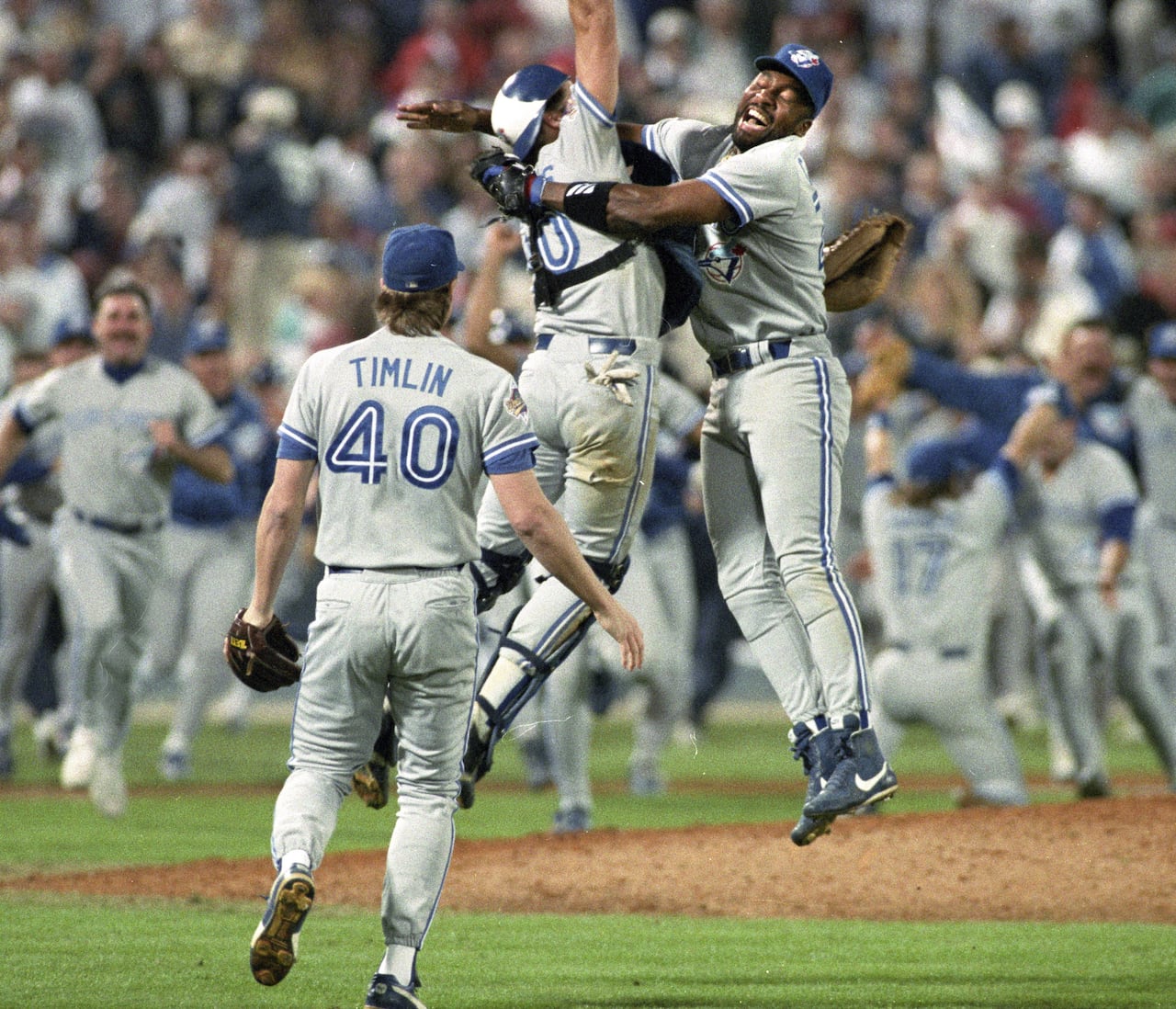 Members of the Blue Jays celebrate moments after clinching their World Series title in Atlanta on Oct. 24, 1992