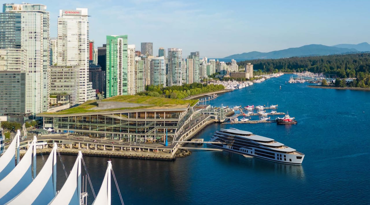 A rendering shows a floating hotel boat in the Vancouver harbour beside the skyline of condo towers