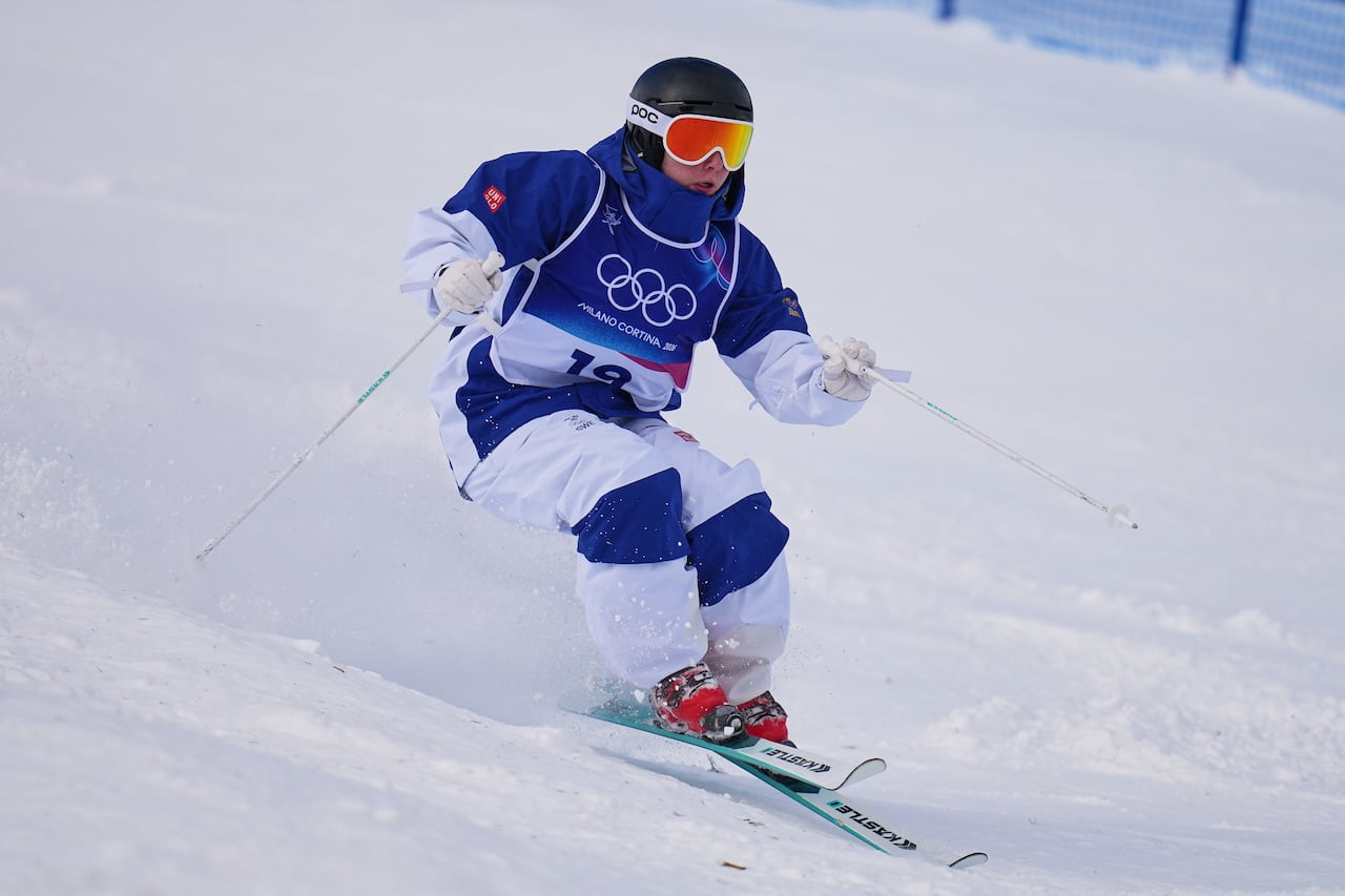 A person skis down a hill