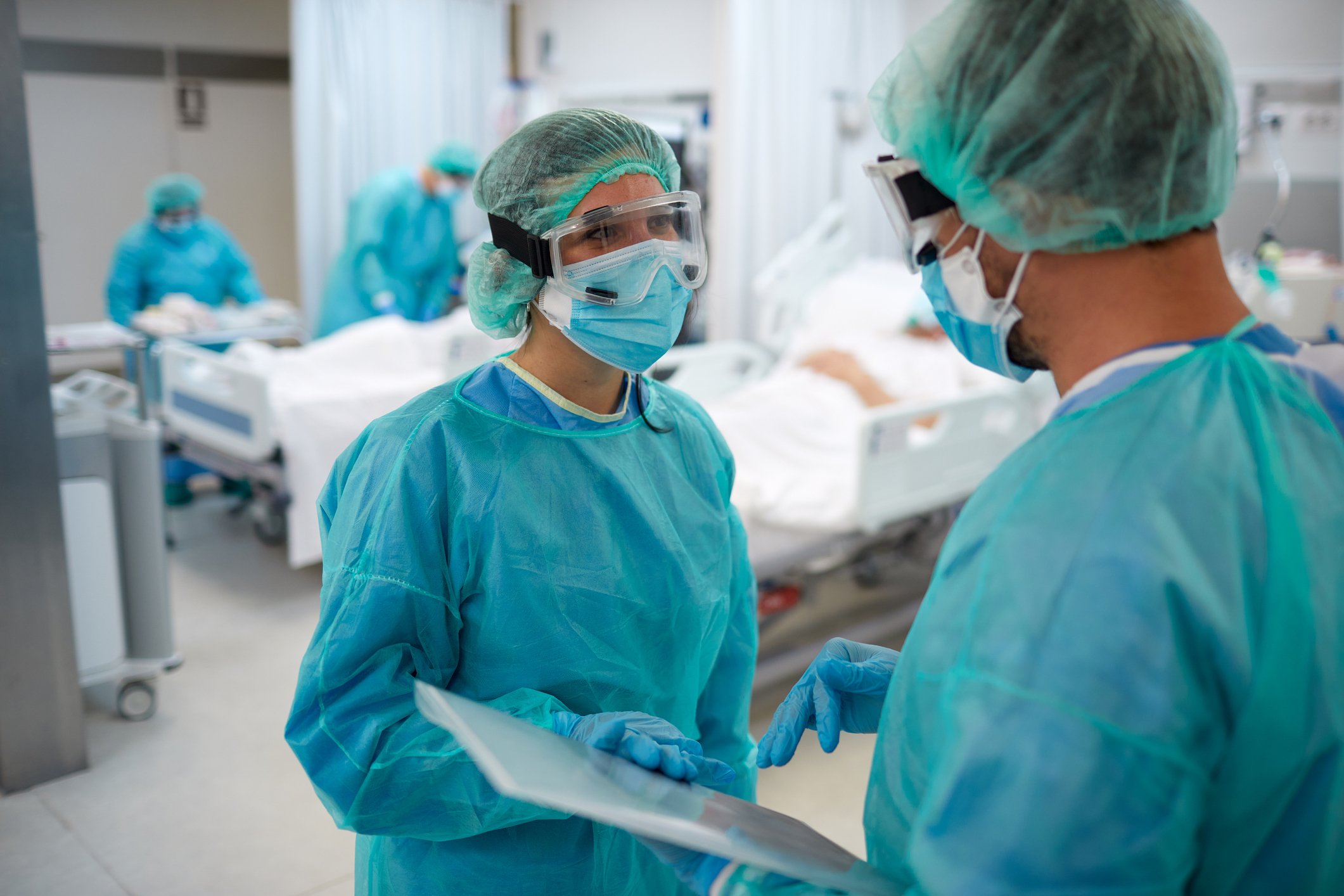 Physicians in a hospital room.