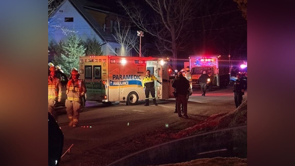 Emergency personnel on residential road.