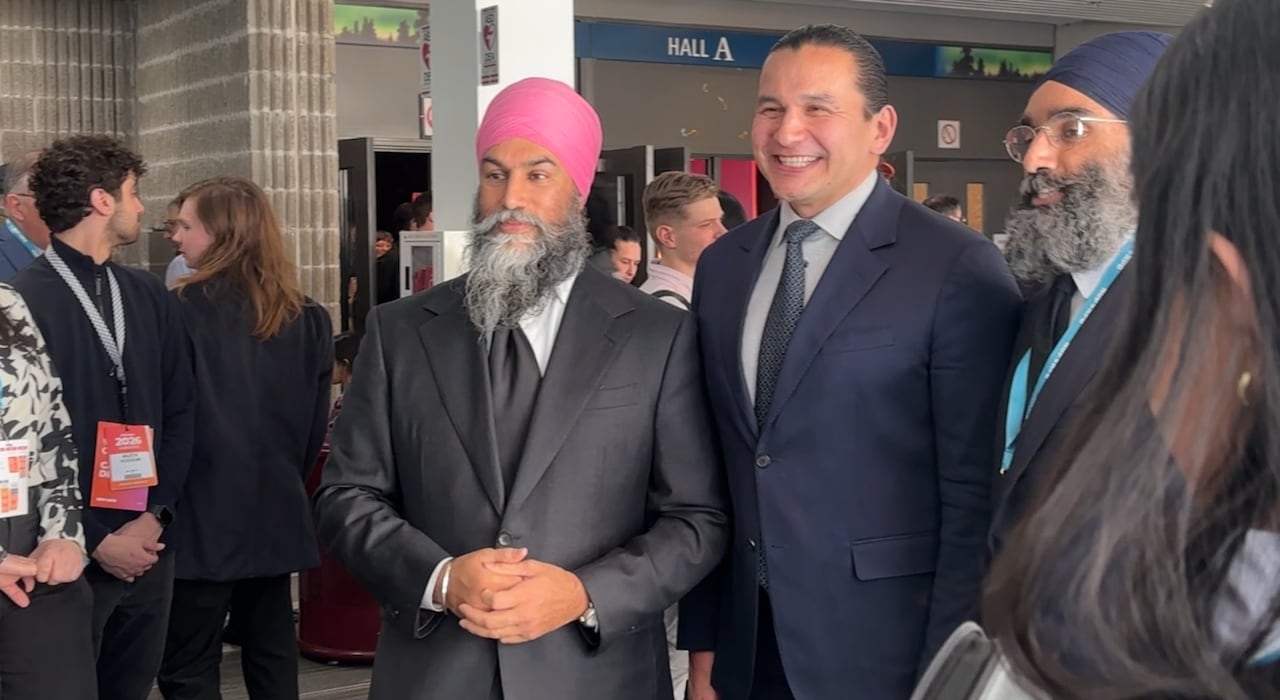Former federal NDP leader Jagmeet Singh and New Democrat Manitoba Premier Wab Kinew pose for a photo together in the lobby during the NDP convention in Winnipeg on March 27.