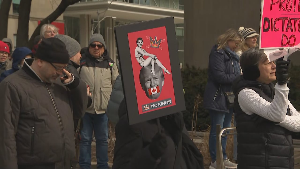Man holding protest sign