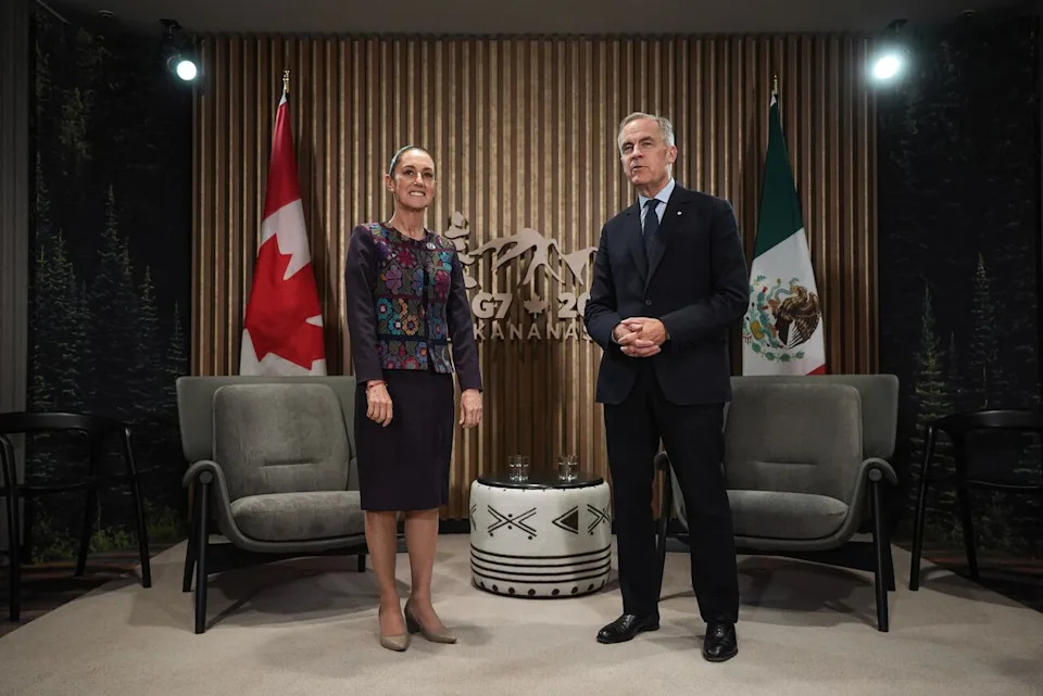 Mexican President Claudia Sheinbaum, left, listens as Canadian Prime Minister Mark Carney speaks before a meeting at the G7 Summit in Kananaskis, Alta., on Tuesday, June 17, 2025. THE CANADIAN PRESS/Darryl Dyck