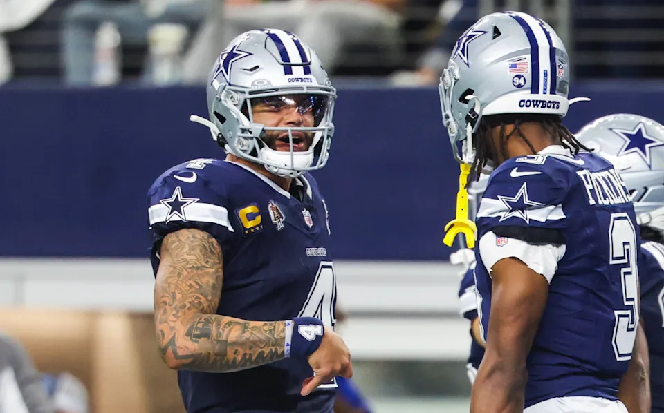 Dallas Cowboys quarterback Dak Prescott (4) celebrates with wide receiver George Pickens (3) after a touchdown pass.Kevin Jairaj-Imagn Images