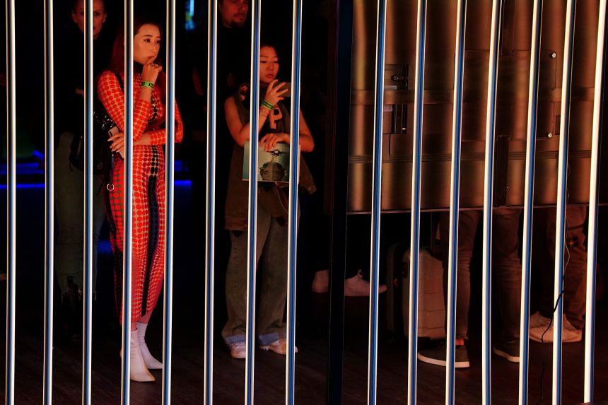 Visitors view NFT art on screens at Dreamverse in New York, where Vignesh Sundaresan's Metapurse displayed 