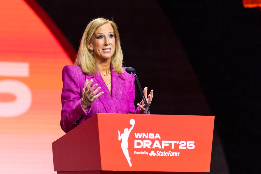 WNBA Commissioner Cathy Engelbert speaks at the 2025 WNBA Draft podium.