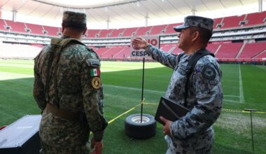 Soccer-Mexican fans enjoy a brief respite from violence as they gaze at World Cup trophy
