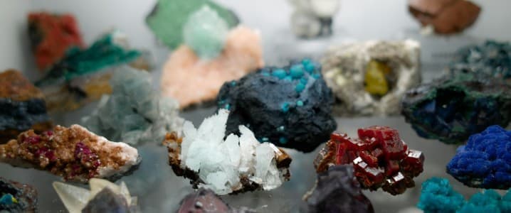 image showing a variety of rare earth resources on a glass shelf