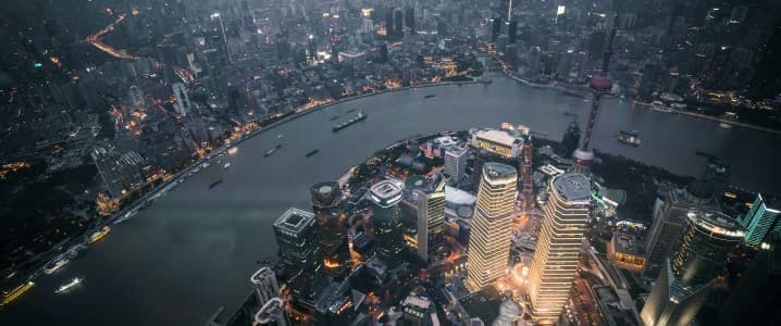 Aerial view of the buildings and river of Shanghai at night