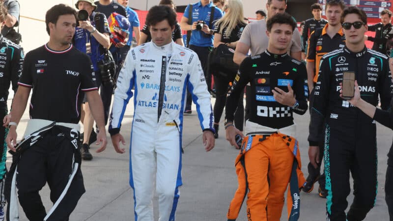 Kimi Antonelli (Mercedes), Sergio Perez (Cadillac), Carlos Sainz Jr (Williams-Mercedes), Lando Norris (McLaren-Mercedes) and George Russell (Mercedes) in the paddock before the 2026 pre-season test in Bahrain