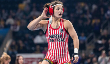North Central's Bella Mir celebrates after winning the 145 pound title during the champion ...