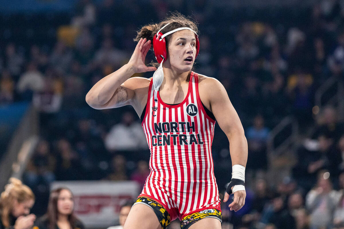 North Central's Bella Mir celebrates after winning the 145 pound title during the champion ...