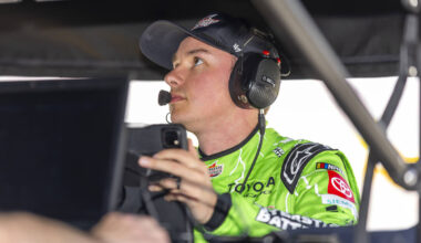 Christopher Bell (20) looks at diagnostics under his pit tent before qualifying for the NASCAR ...
