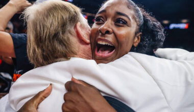 Aces forward Cheyenne Parker-Tyus hugs Aces owner Mark Davis after winning the WNBA championshi ...