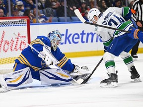 Jake Debrusk takes a shot against Sabres goalie Ukko-Pekka Luukkonen during the first period