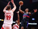 Daniss Jenkins #24 of the Detroit Pistons drives to the net against Jakob Poeltl #19 of the Toronto Raptors during the first half of their NBA game at Scotiabank Arena Wednesday, Feb. 11, 2026.

