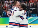 Brady Tkachuk and Quinn Hughes of Team USA celebrate a 2-1 overtime victory over Canada in the gold medal game at the Milano Santagiulia Ice Hockey Arena on Feb. 22, 2026 in Milan, Italy.