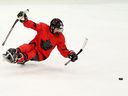 Rob Armstrong #61 of Team Canada with the puck during the Para Ice Hockey Preliminary Round Match between Team Canada and Team Czechia on day four of the Milano Cortina 2026 Winter Paralympic Games at Milano Santagiulia Ice Hockey Arena on March 10, 2026, in Milan, Italy.