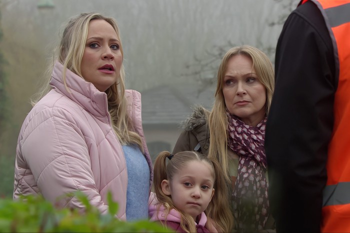 29_03_emm_tracy_leave_02 Tracy, Vanessa and Frankie stood in the village in a scene from Emmerdale