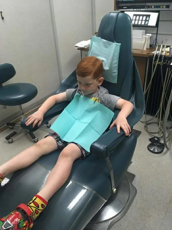 Heather Harrington's son, Reid, 6, sits in the Chan dentistry office's patient room. He was a patient until last year.