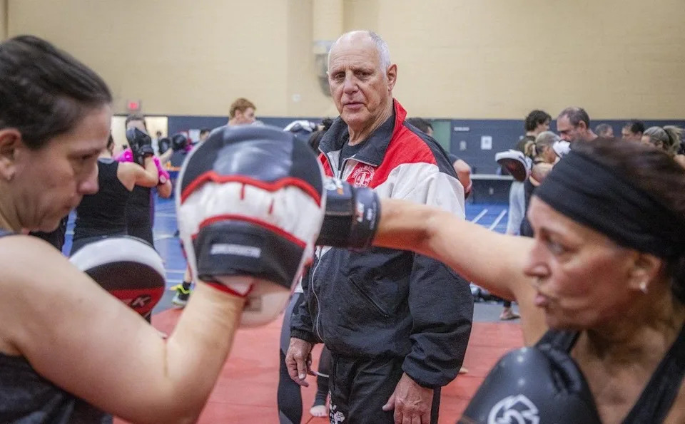  Jean-Yves “The Iceman” Theriault, a former world kick-boxing champion, moves through the space offering guidance and encouragement to participants during sessions at the Kick It for Parkinson’s fundraiser.