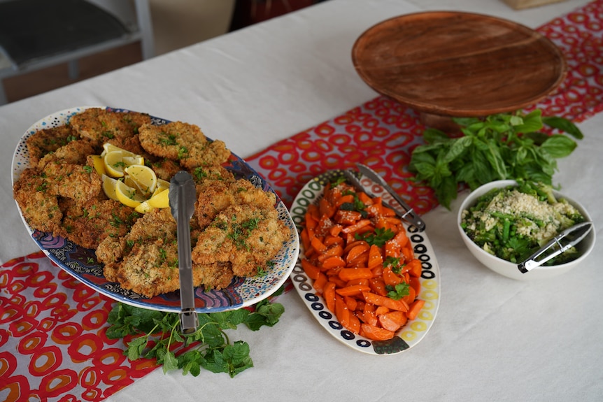 Food on plates displayed on a table.