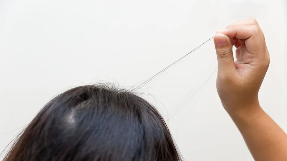A person pulling at their hair
