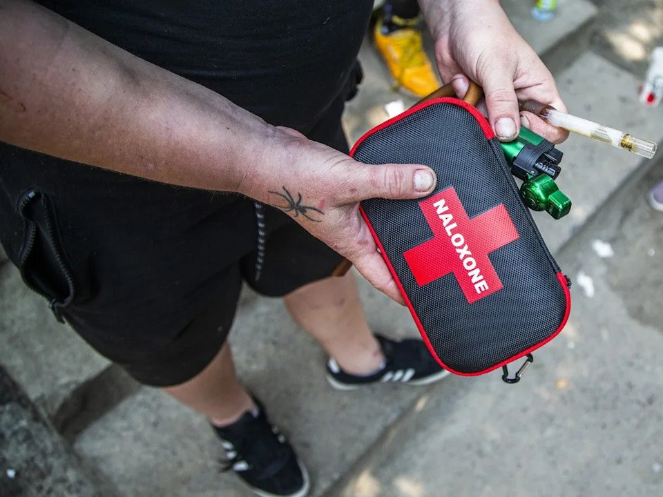 A 2024 file photo of an Ottawa advanced care paramedic displaying a naloxone kit.