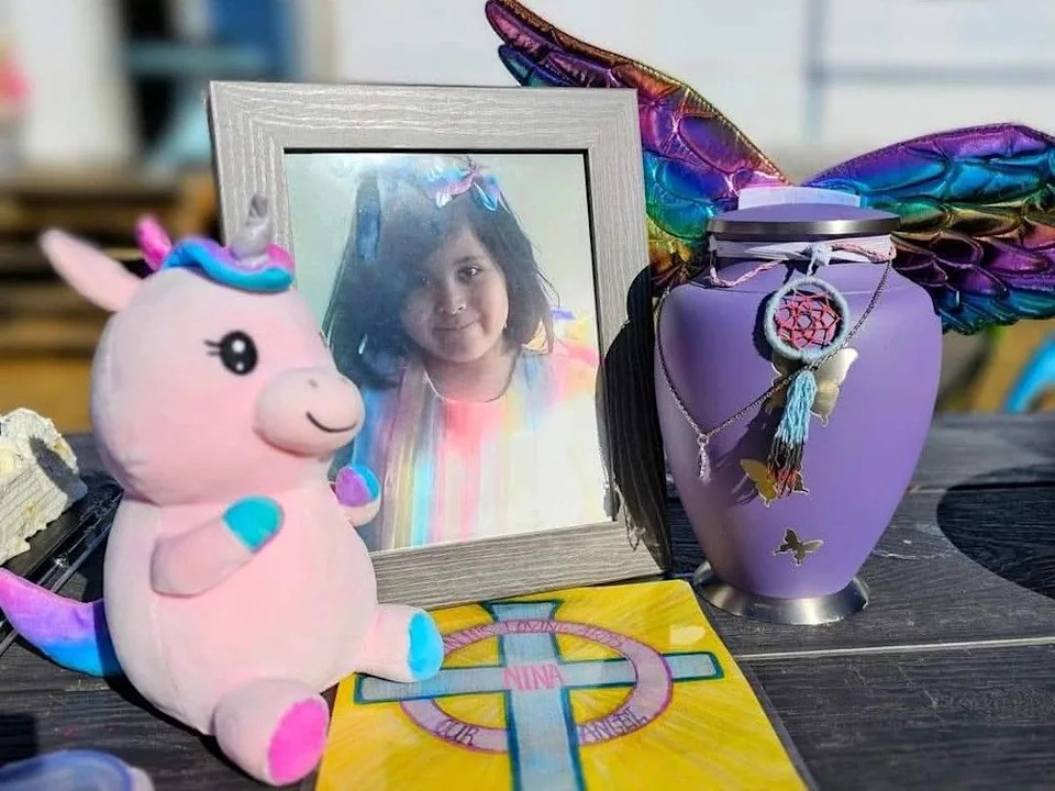  Pictured is a framed photo of Nina Napope Dumais, an eight-year-old girl who was killed more than two years ago.